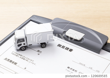 A quote and truck on a desk 120689585