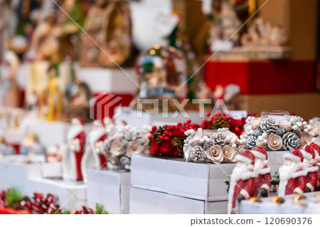 Holiday Market Stall Displaying Wreaths and Christmas Decorations Holiday Market Stall Displaying Wreaths and Christmas Decorations 120690376