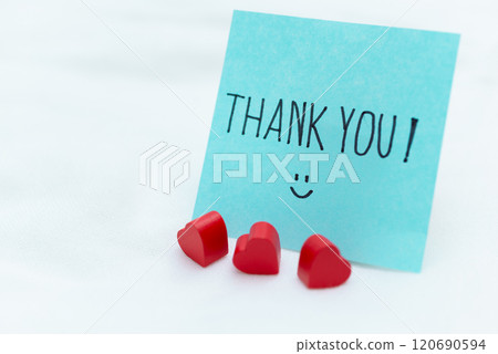 Thank you note with heart decorations home office greeting card calm environment close-up view business appreciation concept Thank you note with heart decorations home office greeting card calm environment close-up view business appreciation concept 120690594