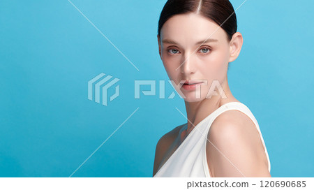 Beautiful young woman with clean fresh skin on blue background, Face care, Facial treatment, Cosmetology, beauty and spa, women portrait. 120690685