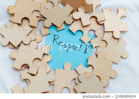 Promoting business values respect through puzzle pieces in a creative workspace indoor setting inspirational concept 120690924