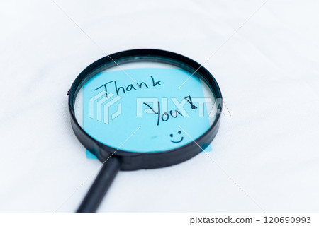 Gratitude message magnified business thank you note office space image capture positive environment close-up view appreciation concept 120690993