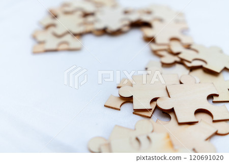 Strategic business puzzle solving session office team collaboration professional environment close-up view problem-solving concept 120691020