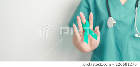 Doctor holding Teal Ribbon for January Cervical Cancer Awareness month. Uterus and Ovaries, Cervix, Endometriosis, Hysterectomy, Uterine fibroids, Reproductive, Healthcare and World cancer day Doctor holding Teal Ribbon for January Cervical Cancer Awareness month. Uterus and Ovaries, Cervix, Endometriosis, Hysterectomy, Uterine fibroids, Reproductive, Healthcare and World cancer day 120691276