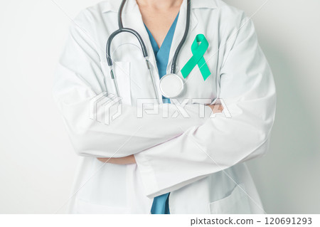 Doctor holding Teal Ribbon for January Cervical Cancer Awareness month. Uterus and Ovaries, Cervix, Endometriosis, Hysterectomy, Uterine fibroids, Reproductive, Healthcare and World cancer day 120691293