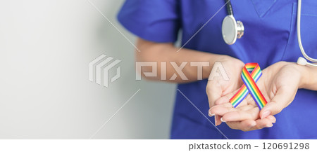 Doctor with LGBTQ Rainbow ribbon for Support Lesbian, Gay, Bisexual, Transgender and Queer community and happy Pride month concept Doctor with LGBTQ Rainbow ribbon for Support Lesbian, Gay, Bisexual, Transgender and Queer community and happy Pride month concept 120691298