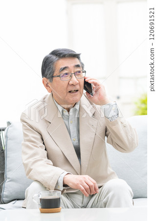 Senior man talking on a smartphone Senior man talking on a smartphone 120691521