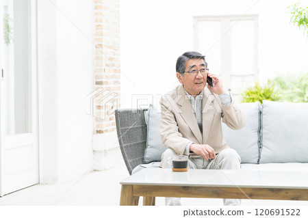 Senior man talking on a smartphone Senior man talking on a smartphone 120691522