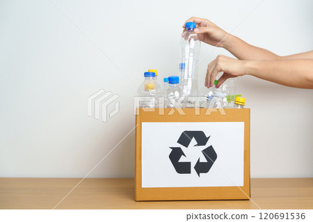 Volunteer keep plastic bottle into paper box at home or office. Hand Sorting Recycle garbage. Ecology, Environmental, pollution, Dispose recycling, waste management and trash Separation concept Volunteer keep plastic bottle into paper box at home or office. Hand Sorting Recycle garbage. Ecology, Environmental, pollution, Dispose recycling, waste management and trash Separation concept 120691536