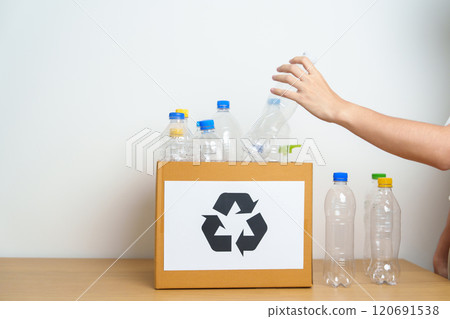 Volunteer keep plastic bottle into paper box at home or office. Hand Sorting Recycle garbage. Ecology, Environmental, pollution, Dispose recycling, waste management and trash Separation concept Volunteer keep plastic bottle into paper box at home or office. Hand Sorting Recycle garbage. Ecology, Environmental, pollution, Dispose recycling, waste management and trash Separation concept 120691538