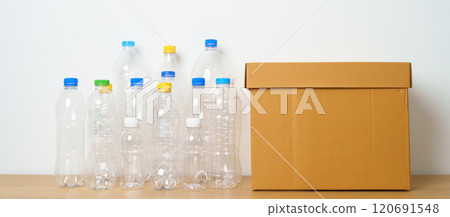 Plastic bottle in paper box at home or office. Recycle garbage Sorting. Plastic Free, Ecology, Environmental, pollution, Dispose recycling, waste management and trash Separation concept Plastic bottle in paper box at home or office. Recycle garbage Sorting. Plastic Free, Ecology, Environmental, pollution, Dispose recycling, waste management and trash Separation concept 120691548