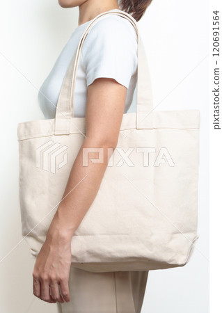 Woman with Eco Shopping tote bag with Copy space for text. Environmental Protection, Zero waste, Reusable, Say No Plastic, Sustainability, Eco Friendly, World Environment day and Earth day concept 120691564
