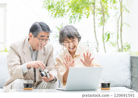 Senior couple talking on a video call 120691591