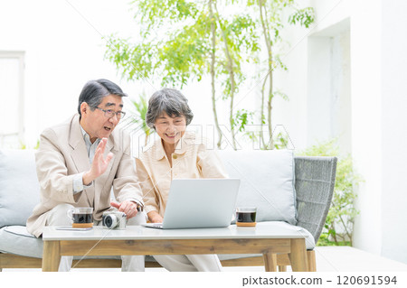 Senior couple talking on a video call Senior couple talking on a video call 120691594