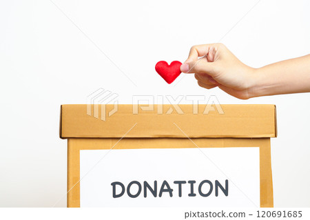 Organ Donation, Charity, Volunteer, Giving and blood Concept. Hand holding red heart into donate box for support poor, homeless, CSR social responsibility, world heart and  mental health day 120691685