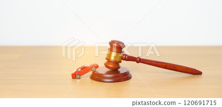 Car Law, Insurance, auto Tax, Auction and Bidding concepts. crashed small toy car models with Judges gavel on desk in courthouse. Car Law, Insurance, auto Tax, Auction and Bidding concepts. crashed small toy car models with Judges gavel on desk in courthouse. 120691715