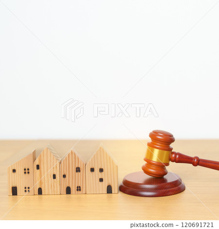 Real Estate Law, Home Insurance, property Tax, Auction and Bidding concepts. small toy house model with gavel justice hammer on desk in courthouse. Real Estate Law, Home Insurance, property Tax, Auction and Bidding concepts. small toy house model with gavel justice hammer on desk in courthouse. 120691721