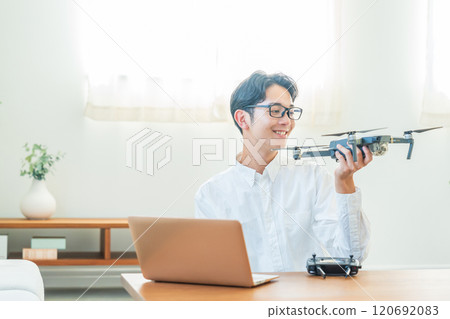 Drone, computer, young man Drone, computer, young man 120692083