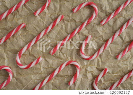 Top view image capturing multiple red and white striped candy canes 120692137
