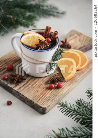 mulled wine with orange slices, cranberry and cinnamon sticks 120692164