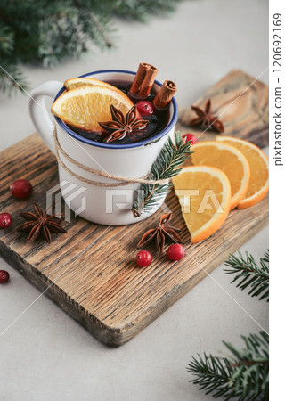 mulled wine with orange slices, cranberry and cinnamon sticks mulled wine with orange slices, cranberry and cinnamon sticks 120692169