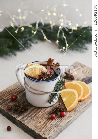 mulled wine with orange slices, cranberry and cinnamon sticks 120692170