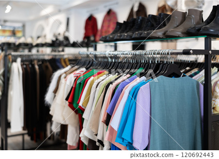 Colorful array of female clothes shoes in shop display, creating vibrant window in clothing store 120692443