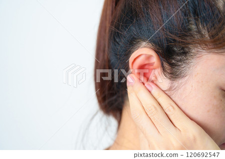 Woman holding her painful Ear. Ear disease, Atresia, Otitis Media, Inflation, Pertorated Eardrum, Meniere syndrome, otolaryngologist, Ageing Hearing Loss and Health concept 120692547