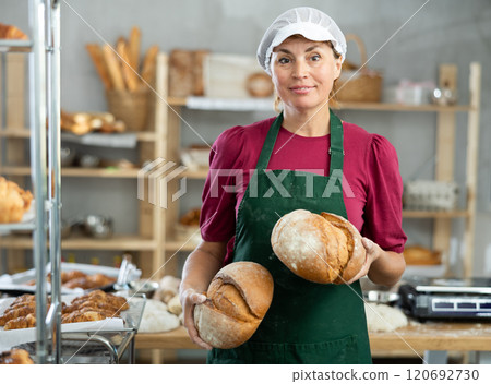 Adult female baker with homemade bread 120692730