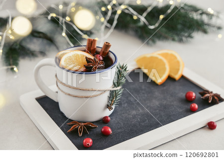 mulled wine with orange slice, cranberry and cinnamon sticks mulled wine with orange slice, cranberry and cinnamon sticks 120692801