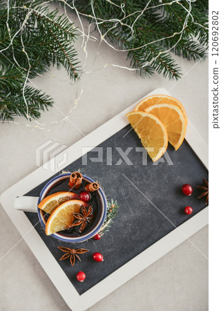 mulled wine with orange slice, cranberry and cinnamon sticks mulled wine with orange slice, cranberry and cinnamon sticks 120692802