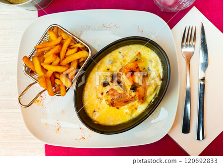 Popular dish of French cuisine is the escalope Savoyard 120692833