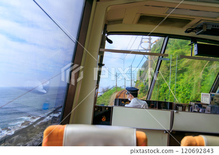 Katase Shirata Beach. A view from the window of an Izu Kyuko Line train running along the coastline of the Izu Peninsula. Inside an Izu Kyuko Line train, Izu Peninsula, Shizuoka Prefecture 120692843