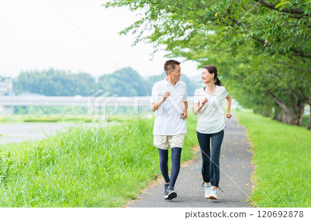 Senior couple doing jogging 120692878