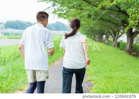 Back view of a senior couple jogging Back view of a senior couple jogging 120692879