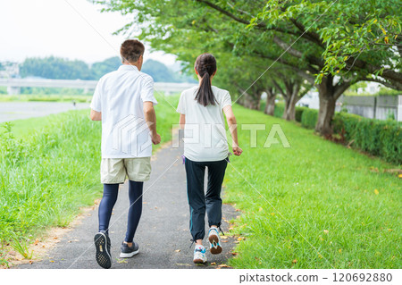 Back view of a senior couple jogging Back view of a senior couple jogging 120692880