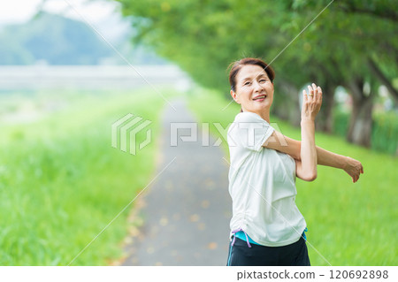 Senior woman doing stretching Senior woman doing stretching 120692898