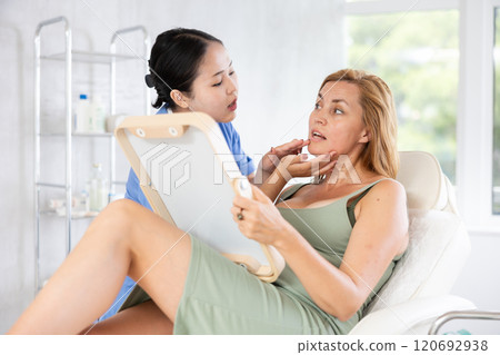 young doctor consulting with mirror young doctor consulting with mirror 120692938
