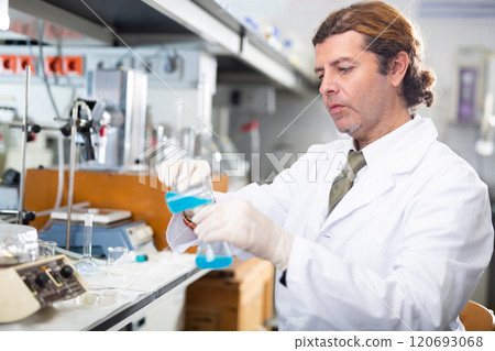 Confident man technician working in research laboratory 120693068