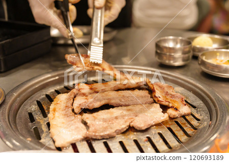 Chef Grilling meat pork on stove serve in restaurant. Korean food and BBQ traditional style 120693189