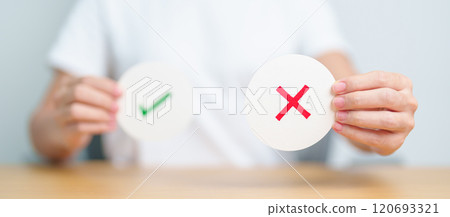 Woman show Wrong symbol paper. True and false, accept and rejected, evaluation, Vote, Poll, Yes or No and Survey concepts Woman show Wrong symbol paper. True and false, accept and rejected, evaluation, Vote, Poll, Yes or No and Survey concepts 120693321