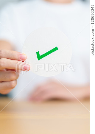 Woman show Right symbol paper. True and false, accept and rejected, evaluation, Vote, Poll, Yes or No and Survey concepts 120693345