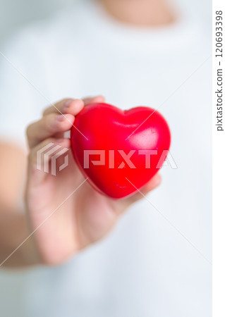 hand holding red heart shape in hospital. love, donor, world heart day, world health day, CSR donation and Insurance concepts 120693398