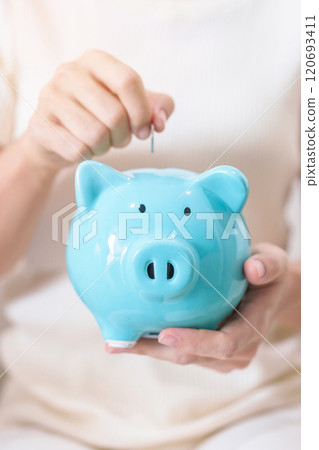 Money Saving for Future Plan, Retirement fund, Pension, Investment, Wealth Business and Financial concepts. hand holding and putting into piggy bank, Money Counting for World Savings day and Donate Money Saving for Future Plan, Retirement fund, Pension, Investment, Wealth Business and Financial concepts. hand holding and putting into piggy bank, Money Counting for World Savings day and Donate 120693411