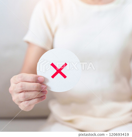 Woman show Wrong symbol paper. True and false, accept and rejected, evaluation, Vote, Poll, Yes or No and Survey concepts Woman show Wrong symbol paper. True and false, accept and rejected, evaluation, Vote, Poll, Yes or No and Survey concepts 120693419