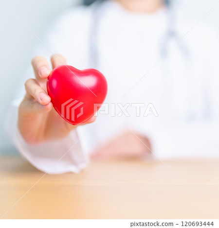 Doctor hand holding red heart shape in hospital. love, donor, world heart day, world health day, CSR donation and Insurance concepts 120693444