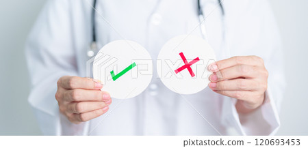 Doctor show Wrong symbol paper. True and false, accept and rejected, evaluation, Diagnosis, Vote, Poll, Yes or No, Health, Medical and Survey concepts Doctor show Wrong symbol paper. True and false, accept and rejected, evaluation, Diagnosis, Vote, Poll, Yes or No, Health, Medical and Survey concepts 120693453