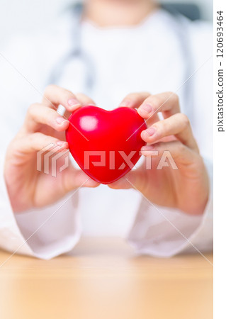 Doctor hand holding red heart shape in hospital. love, donor, world heart day, world health day, CSR donation and Insurance concepts 120693464