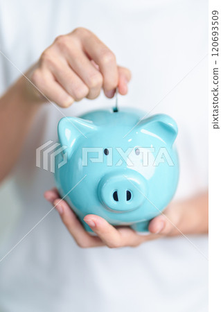 Money Saving for Future Plan, Retirement fund, Pension, Investment, Wealth Business and Financial concepts. hand holding and putting into piggy bank, Money Counting for World Savings day and Donate Money Saving for Future Plan, Retirement fund, Pension, Investment, Wealth Business and Financial concepts. hand holding and putting into piggy bank, Money Counting for World Savings day and Donate 120693509