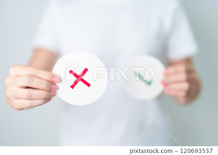 Woman show Wrong symbol paper. True and false, accept and rejected, evaluation, Vote, Poll, Yes or No and Survey concepts Woman show Wrong symbol paper. True and false, accept and rejected, evaluation, Vote, Poll, Yes or No and Survey concepts 120693537